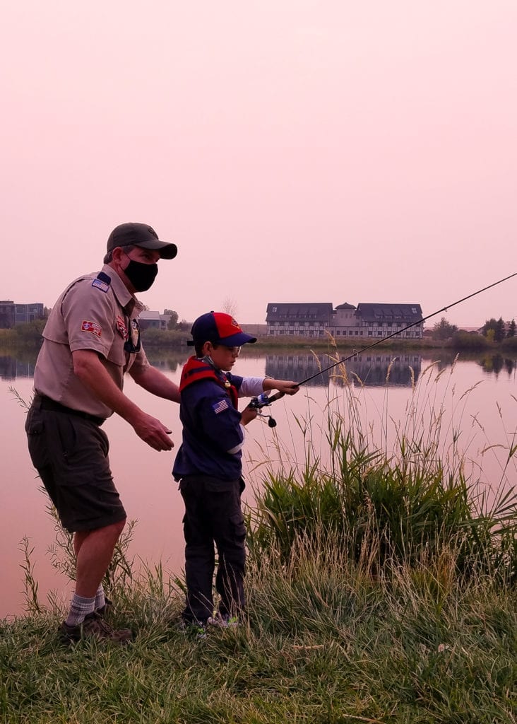 Photo Contest, Adult 2nd Place:   Rebecca Langlois, Den Leader, Pack 3671, Bozeman (Cubmaster Matt O'Brien teaching Wolf how to cast)