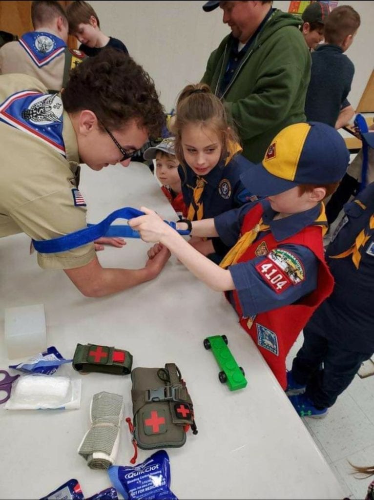 Photo contest, Adult Honorable Mention:  Tony Higuera, Committee Member, T. 1911, Missoula (Eagle Scout assisting Cub Scout with Stop the Bleed)